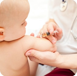 Nurse vaccinating a baby.